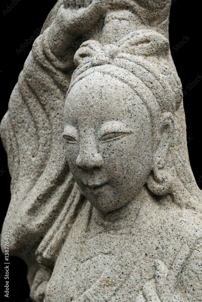 Asian woman stone carving