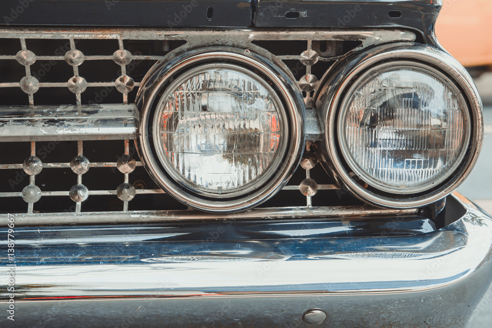 Classic car with close-up on headlights or Headlight lamp of retro  car vintage style