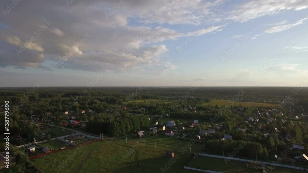 Aerial summer scene of village with private houses among the green woods and fields, Russia Aerial summer scene of village with private houses among the green woods and fields, Russia