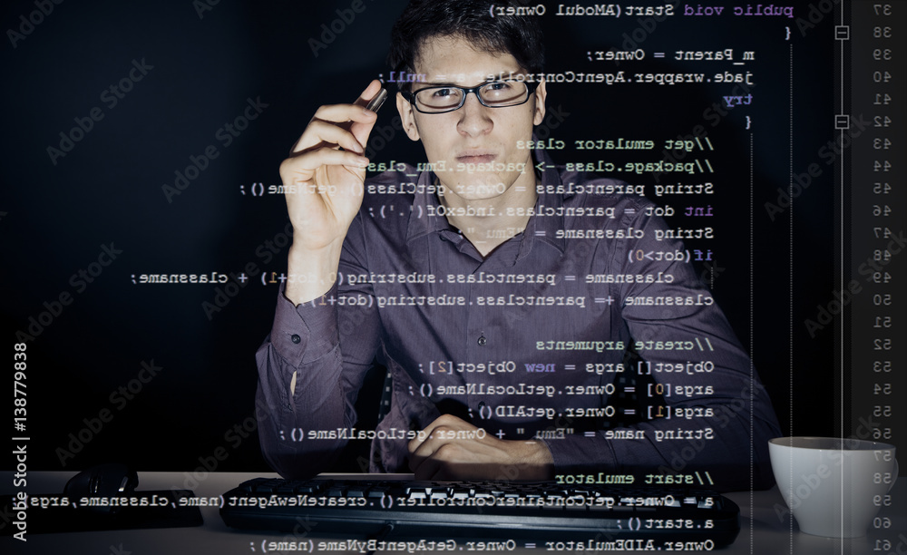 Young Man Analyzing His Java Code Young Man Analyzing His Java Code