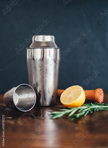 An afternoon cocktail, making a whiskey sour with rosemary and lemon