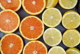 Juicy orange and lemon citrus cut in half