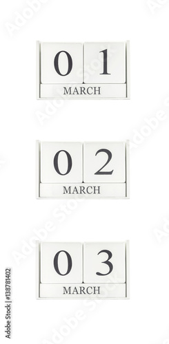 Closeup group of white wooden calendar with black 1 , 2 , 3 march word , three date calendar isolated on white background