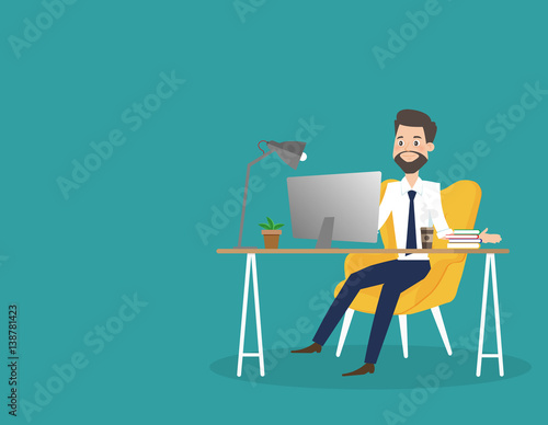 Business man working on computer at office desk.