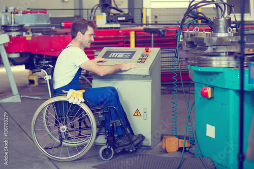 disabled worker in wheelchair in factory