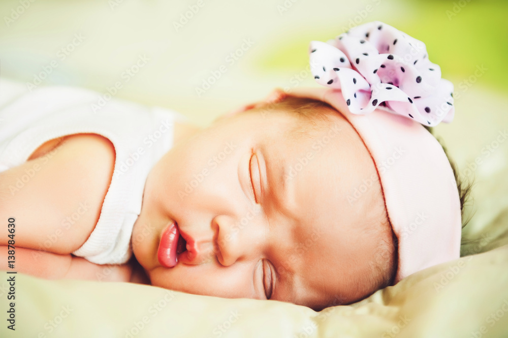 Close up portrait of adorable 1 week old baby girl Close up portrait of adorable 1 week old baby girl