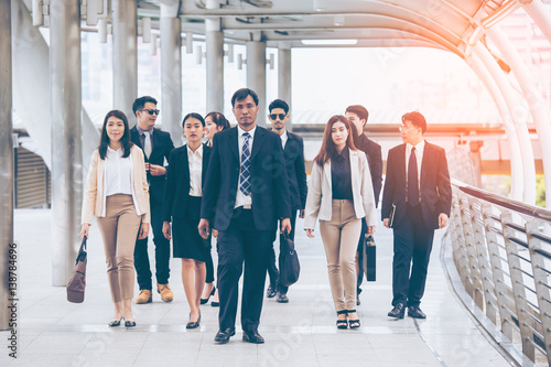 Asian Business team walking, protrait business concept, vintage color tone.