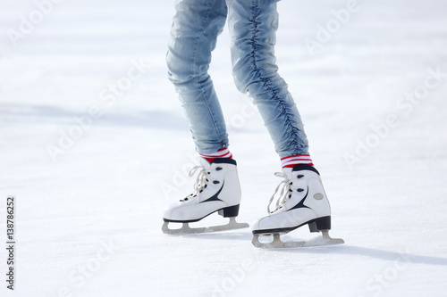 feet skating on the ice rink.