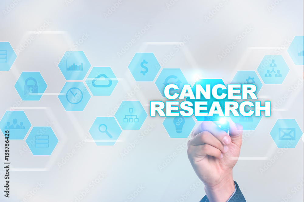 Medical doctor drawing cancer research on the virtual screen. Medical doctor drawing cancer research on the virtual screen.