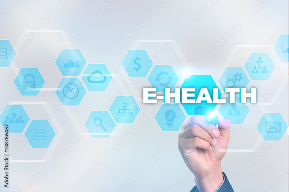 Medical doctor drawing e-health on the virtual screen.