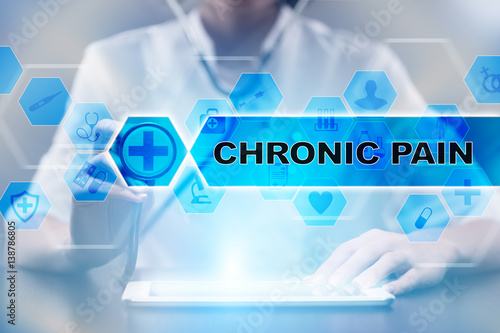 Medical doctor using tablet PC with chronic pain medical concept.