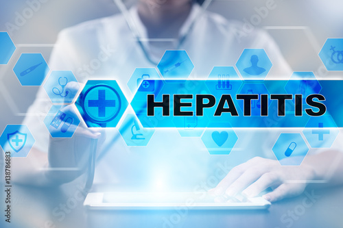 Obraz na plátně Medical doctor using tablet PC with hepatitis medical concept.