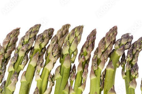 Heap of green asparagus  vegetables isolated on white background photo