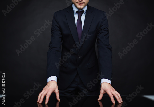 Tablou pe pânză Closeup portrait of unrecognizable authority figure wearing business suit standi