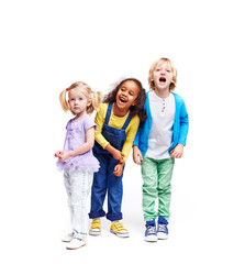 Studio portrait of children against white background:  full body shot of three kids in colorful clothes, African girl, blond boy and cute little girl, laughing and screaming loudly with mouths open