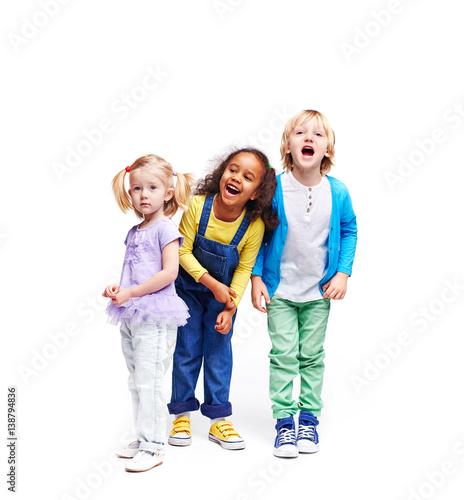 Obraz na płótnie Studio portrait of children against white background:  full body shot of three k