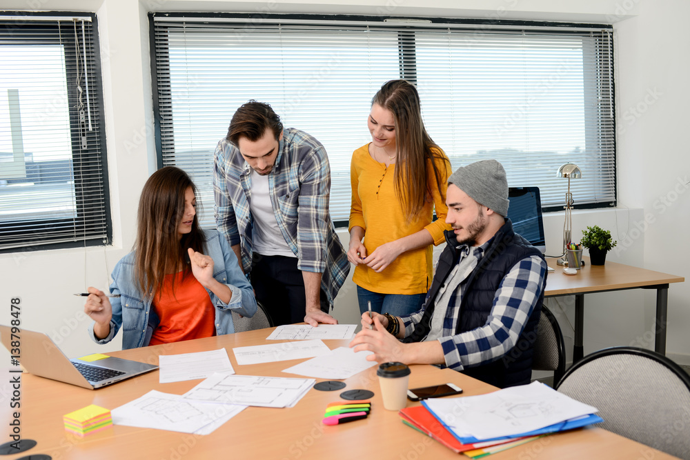 Fototapeta premium group of young cool hipster creative business people in casual wear working together in meeting room of a startup company