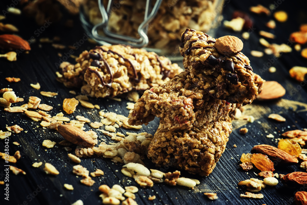 Cereal muesli bars, dark background, selective focus Cereal muesli bars, dark background, selective focus