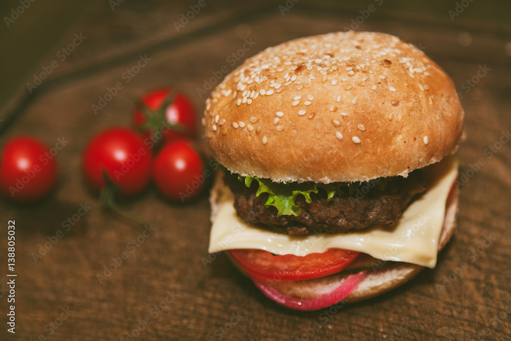 cheeseburger with pork on a wooden board cheeseburger with pork on a wooden board