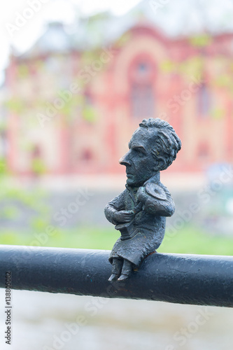 Mini sculpture of Bela Bartok on the handrail of the bridge. Uzhgorod, Ukraine photo