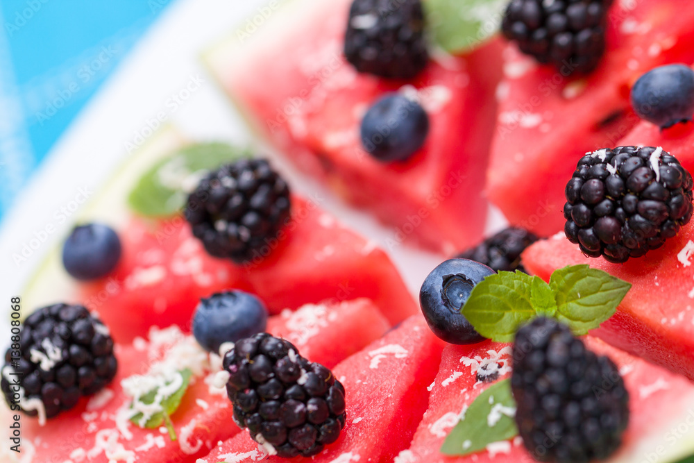 Φωτογραφία Watermelon pizza slices with fresh blueberry, blackberry, chips of white chocolate and green mint leaves