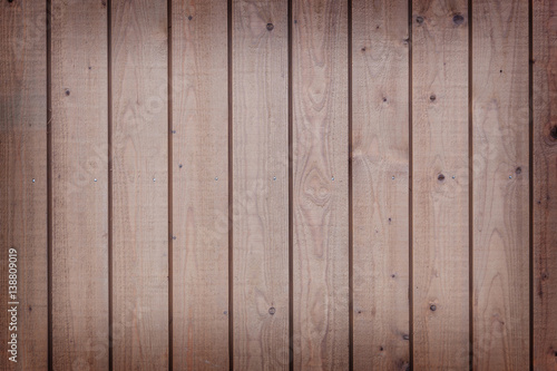 horizontal part of vertical planks with light brown paint