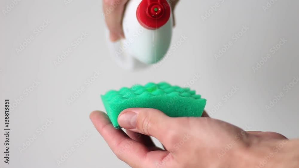 Sponge with detergent in man's hands Sponge with detergent in man's hands