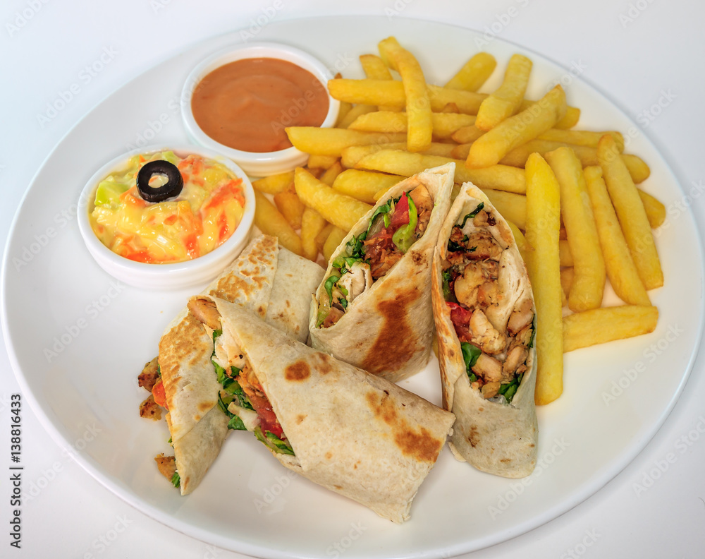 Chicken shawarma with coleslaw, sauce and french fries