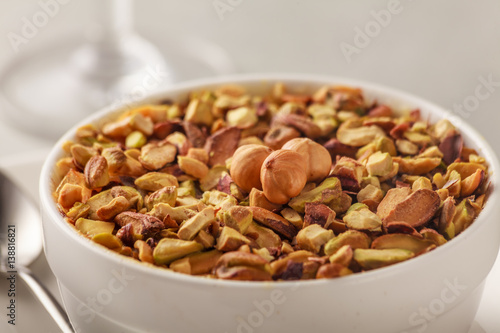 Pistachio and hazelnuts on a bowl