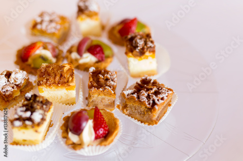 Variety of cakes on a glass plate