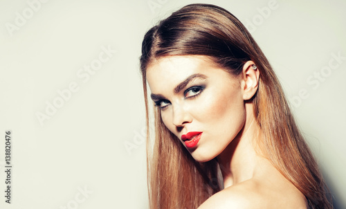 Pretty girl with red lips and long hair, copy space