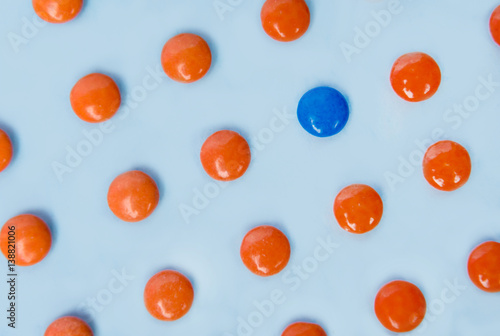 Colorful sweeties candy over blue table background.