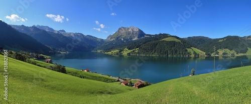 Lake Wagital in summer. Green meadow and mount Fluebrig. photo