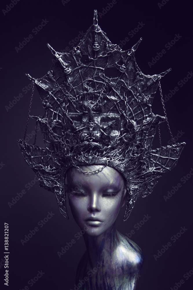 Mannequin in metallic headwear with chains Mannequin in metallic headwear with chains