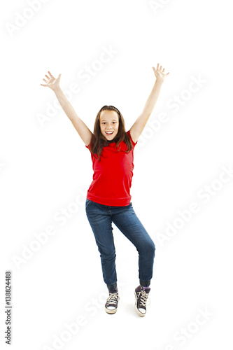 Success young girl dancing and celebrating. Isolated on white background.