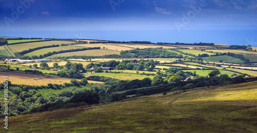 hills and pastures in Exmoor. On the horizon is seen sea. North Devon. UK