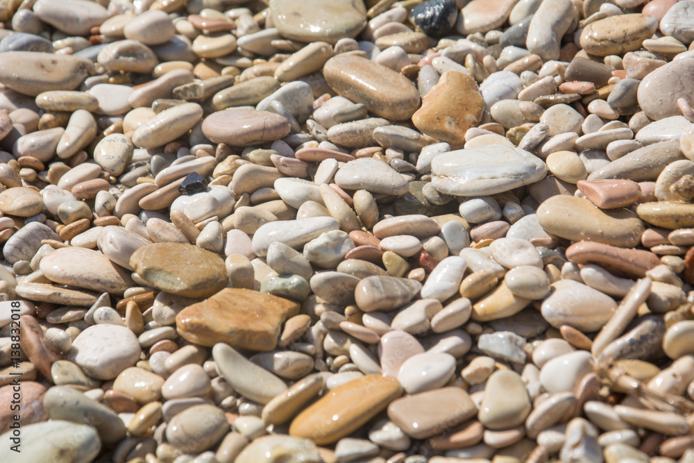 Close up photo of pebble stones in the sun Close up photo of pebble stones in the sun
