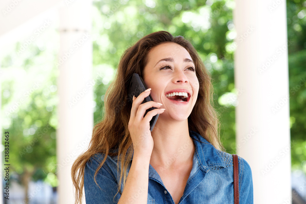 Close up young woman outside talking on cellphone Close up young woman outside talking on cellphone