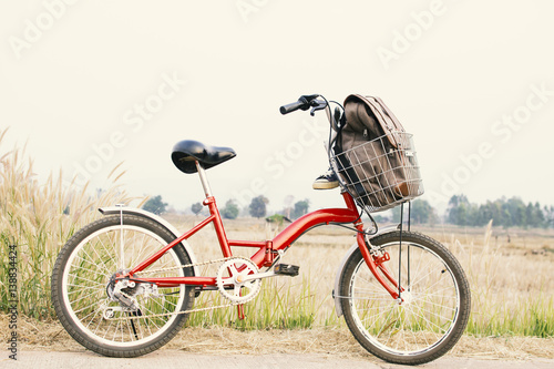 Jeans sneakers on bicycle ,Concept journey,hipster tone