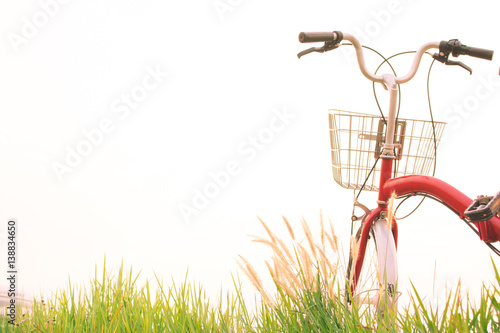 Vintage of bicycle on grass field, selective and soft focus