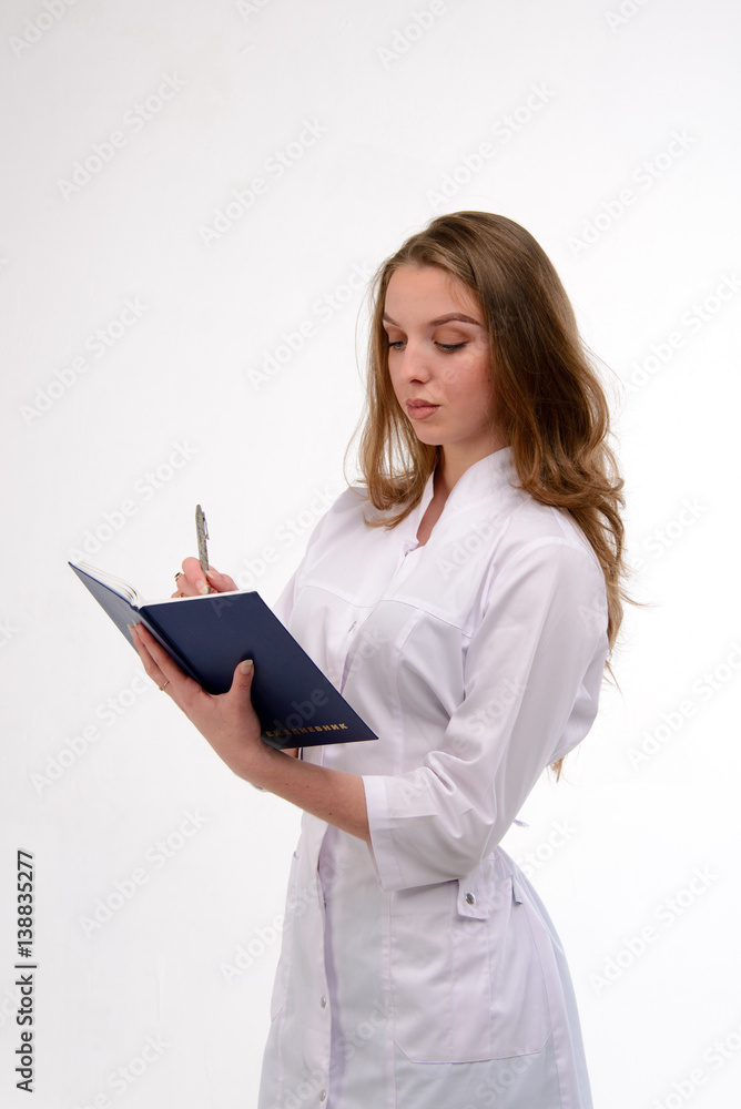 Attractive young female doctor on white Attractive young female doctor on white