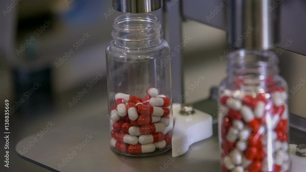 Fat burner pills are falling into an empty transparent cup until the top. We can see that one cup is already full.
Fat burner pills are falling into an empty transparent cup until the top. We can see that one cup is already full.