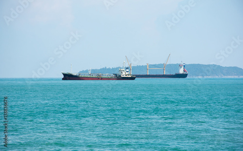 Fototapeta Naklejka Na Ścianę i Meble -  Soft focused picture of two merchant ships parking port in Phuket Thailand