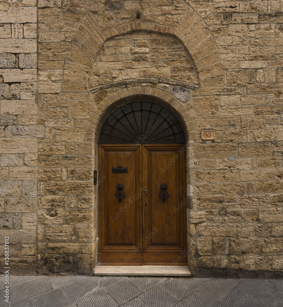 A beautiful entrance door in San Gimignano_Tuscany, Italy, Europe