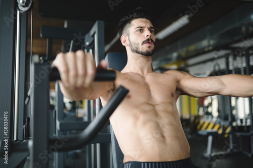 Determined man working out in gym