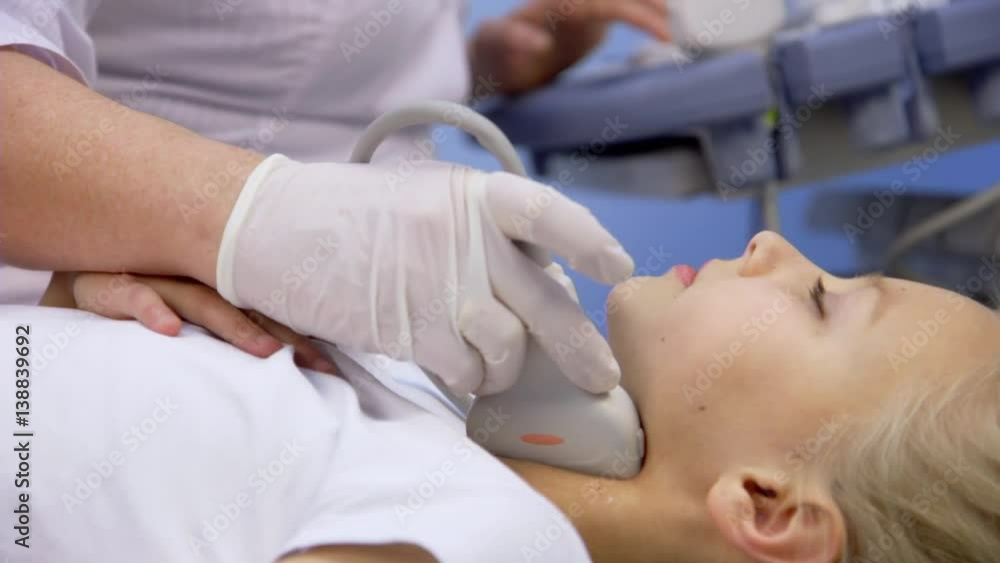 girl in the hospital doing ultrasound girl in the hospital doing ultrasound