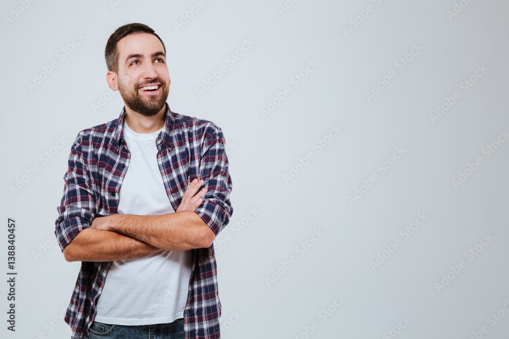 Laughing Bearded man in shirt with crossed arms Laughing Bearded man in shirt with crossed arms