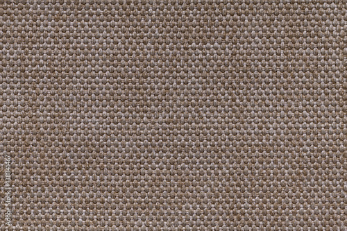 Brown textile background with checkered pattern, closeup. Structure of the fabric macro.