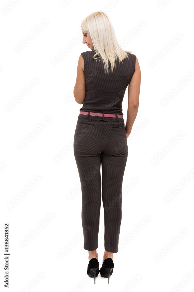Full length of a beautiful young woman in overall standing over white Full length of a beautiful young woman in overall standing over white