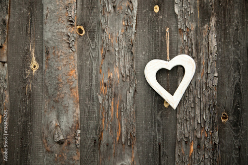 White heart on rustic wooden background